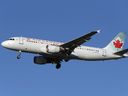 An Air Canada Airbus A320-200 airplane prepares to land at Vancouver's international airport in Richmond, BC