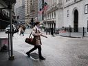 People walk by the New York Stock Exchange on April 25, 2022 in New York City. 