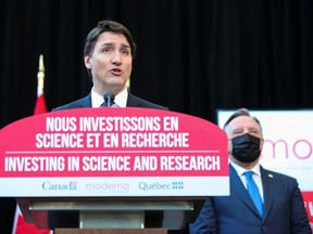 Prime Minister Justin Trudeau announces the construction of a new Moderna mRNA vaccine production plant as Quebec Premier Francois Legault looks on in Montreal.