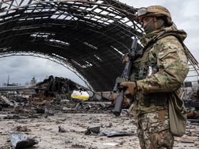 A Ukrainian serviceman stands guard in Hostomel, Ukraine.