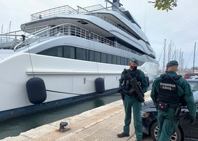 Spanish Civil Guards stand by the Tango superyacht, belonging to Russian oligarch Viktor Vekselberg, which was seized on behalf of U.S. authorities, as it is docked at Mallorca, Spain on April 4, 2022.