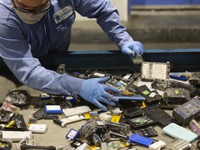 A worker sorts batteries at the Li-Cycle lithium-ion battery recycling facility in Kingston, Ontario. Li-Cycle has reached a supply deal with Global commodity giant Glencore plc.