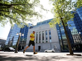 A jogger runs past the Bank of Canada building in Ottawa.