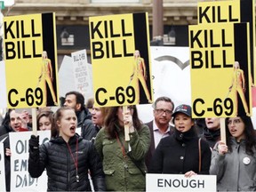 People protest against Bill C-69, in Calgary in 2019.