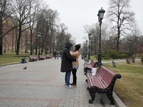 A couple embrace in Moscow, in April.