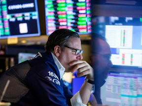 A trader works on the floor of the New York Stock Exchange.