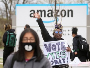 An Amazon Labour Union organizer greets workers outside Amazon’s LDJ5 sortation centre as employees begin voting to unionize a second warehouse in the Staten Island borough of New York City on April 25, 2022.