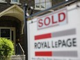 A realtor's for sale sign outside a house that has been sold in Toronto.