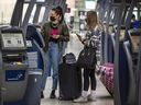 Travellers at Toronto Pearson International Airport on May 3, 2022. 