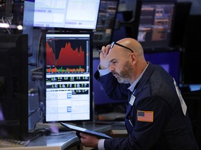 A trader works on the trading floor at the New York Stock Exchange.