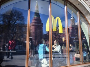 People have lunch at a McDonald's next to the Kremlin in Moscow on March 10, 2022.