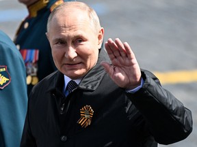 Russian President Vladimir Putin leaves Red Square after the Victory Day military parade in central Moscow on May 9, 2022.