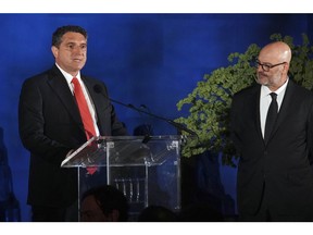 Charlie Stillitano, right, Managing Director for U.S. Lega Serie A, listens as Luigi De Siervo, left, CEO of Lega Serie A, speaks during the 'Calcio Is Back' gala dinner to kick-off Italy's Lega Serie A soccer arrival to the U.S., Tuesday, May 24, 2022, at the Met in New York. (AP Photo/Bebeto Matthews)
