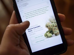 The Ontario Cannabis Store website pictured on a mobile phone.
