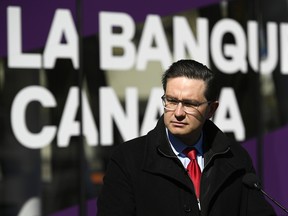 Conservative MP and leadership candidate Pierre Poilievre speaks during a press conference outside the Bank of Canada in Ottawa.