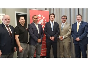 Left to right: Cameron Diggin, Director of Fund Development, Homes For Heroes Foundation; Trevor Smith, Past President, Winnipeg Kinsmen Club; Bradley Robertson, Assistant Vice-President, Mechanical Car, Canadian Pacific; David Howard, CEO, Homes For Heroes Foundation; Kevin Klein, Councillor, City of Winnipeg; Len Isleifson, Special Envoy for Military Affairs for the Province of Manitoba. Credit: Jeff Hiebert