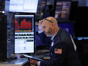 A trader works on the trading floor at the New York Stock Exchange.