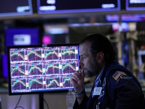 A trader works on the floor of the New York Stock Exchange.