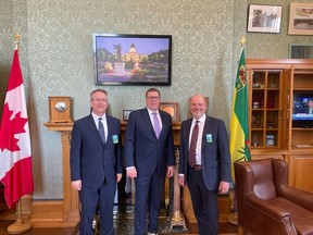 Saskatchewan Premier Scott Moe together with Scott Bolton, President and CEO, UFA, and Fred Thun, Chief Financial Officer, UFA.
