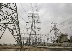 Power lines hang from transmission pylons at the Sahiwal coal power plant, owned by China's state-owned Huaneng Shandong Rui Group, in Sahiwal, Punjab, Pakistan, on Wednesday, June 14, 2017. Pakistan is racing to bridge its power supply gap before national elections next year after a series of widespread blackouts highlighted the fragility of the network and its negative pull on South Asia's second largest economy.