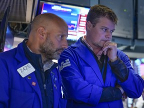 Traders work on the floor at the New York Stock Exchange in New York, Thursday, June 16, 2022.