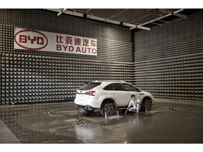 A vehicle sits in an electro-magnetic interference testing lab at the BYD Co. headquarters in Shenzhen, China, on Thursday, Sept. 21, 2017. China will likely order an end to sales of all polluting vehicles by 2030, BYD's Chairman Wang Chuanfu predicted, spurring the nation's leading maker of electric cars to consider supplying batteries to competitors during the powertrain transformation. Photographer: Qilai Shen/Bloomberg