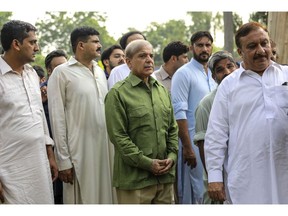 Shehbaz Sharif, center. Photographer: Asad Zaidi/Bloomberg