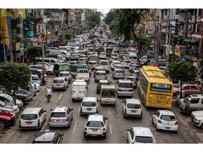 Vehicles sit in traffic along a road in Yangon, Myanmar, on Friday, Aug. 31, 2018. International criticism over Rohingya crisis has damaged Myanmar's reputation, making it harder for companies that sought opportunities in the country after the U.S. lifted broad-based sanctions following its transition to democracy.