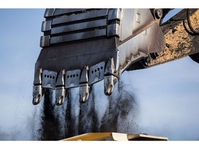 An excavator drops a load of coal into a dump truck at the Tavan Tolgoi coal deposit developed by Erdenes Tavan Tolgoi JSC, a unit of Erdenes Mongol LLC, in Tsogtsetsii, Ömnögovi Province, Mongolia, on Monday, Sept. 24, 2018. Mongolia has expanded its coal reserves by 24 percent at the state-owned giant Tavan Tolgoi mine to 6.34 billion tons, according to Erdenes Tavan Tolgoi Chief Executive Officer Gankhuyag Battulga. Mongolian lawmakers in June approved a plan to sell up to 30% of the coal mine in the Gobi desert, the latest attempt to develop what's anticipated to be massive coking and thermal coal deposit. Photographer: Taylor Weidman/Bloomberg