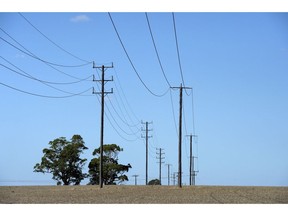 Power lines stretch across farmland in the Latrobe Valley, Australia, on Saturday, Feb. 23, 2019. Australian Prime Minister Scott Morrison is pledging A$2 billion ($1.4 billion) over the next 10 years in direct action to lower greenhouse gas emissions, making a climate pitch to voters ahead of elections due by May. Photographer: Carla Gottgens/Bloomberg
