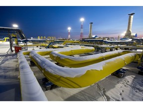 Snow covers sections of connected pipework in the yard as night falls at the Gazprom PJSC Atamanskaya compressor station, part of the Power Of Siberia gas pipeline, near Svobodny, in the Amur region, Russia, on Wednesday, Dec. 11, 2019. The pipeline, which runs from Russia's enormous reserves in eastern Siberia and will eventually be 3,000 kilometers (1,900 miles) long, will help satisfy China's vast and expanding energy needs. Photographer: Andrey Rudakov/Bloomberg