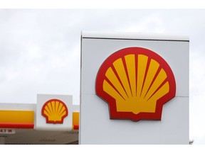 A Shell logo sits on a totem sign at a Royal Dutch Shell Plc petrol filling station in Ewell, U.K., on Wednesday, Sept. 30, 2020. Royal Dutch Shell Plc will cut as many as 9,000 jobs as Covid-19 accelerates a company-wide restructuring into low-carbon energy. Photographer: Chris Ratcliffe/Bloomberg