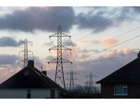 Electricity transmission pylons near homes in Brighton, UK. Photographer: Chris Ratcliffe/Bloomberg