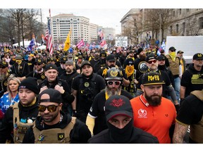 Demonstrators wearing Proud Boys attire gather during the "Million MAGA March" in Washington, D.C., on Dec. 12, 2020.