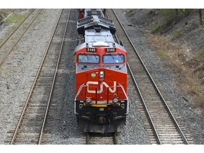 A Canadian National Railway locomotive pulls a train in Montreal, Quebec, Canada, on Tuesday, April 20, 2021. Canadian National Railway Co. offered $30 billion to snatch Kansas City Southern away from a rival, spurring a possible bidding war over one of the industrys biggest deals in decades. Photographer: Christinne Muschi/Bloomberg