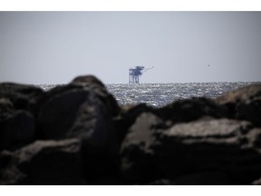 An offshore oil well platform in the Gulf of Mexico. Photographer: Luke Sharrett/Bloomberg