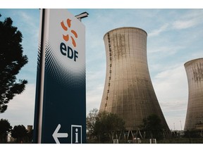 A logo near the cooling towers of the Tricastin Evolutionary Power Reactor (EPR) nuclear power plant, operated by Electricite de France SA (EDF), in Saint-Paul-Trois-Chateaux, France. Photographer: Theo Giacometti/Bloomberg