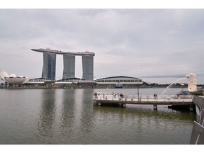 The Marina Bay Sands beyond Merlion Park in the central business district of Singapore, on Wednesday, May 19, 2021. In the financial mecca of Singapore, technology companies have been steadily growing their footprint in recent years, chipping away at the dominance of banks in the island-state's central business district. Photographer: Lauryn Ishak/Bloomberg