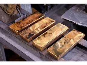 Newly cast 12,5 kilogram gold ingots in the foundry.