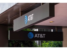 Signage at an AT&T store in San Francisco, California, U.S., on Tuesday, July 20, 2021. AT&T Inc. is scheduled to release earnings figures on July 22. Photographer: David Paul Morris/Bloomberg