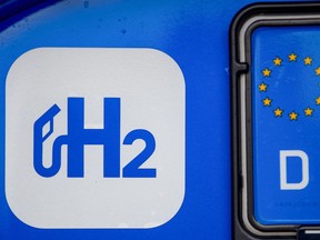 A H2 logo on the rear of a H2 Mobility branded Toyota Motor Corp. Mirai hydrogen fuel cell electric vehicle in Berlin, Germany, on Wednesday, Aug. 25, 2021. Hydrogen remains a marginal part of Shell's energy mix, but the company expects to expand the business as part of its strategy to achieve net-zero emissions by 2050.