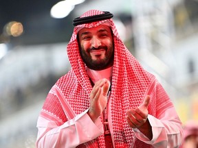 JEDDAH, SAUDI ARABIA - DECEMBER 05: Mohammad Bin Salman Al Saud applauds on the grid before the F1 Grand Prix of Saudi Arabia at Jeddah Corniche Circuit on December 05, 2021 in Jeddah, Saudi Arabia.