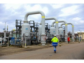 An employee inspects suction filters during routine maintenance at the Messina Compressor Station, operated by Snam SpA, in Gallese, Italy, on Wednesday, Dec. 29, 2021. European gas prices declined to near the lowest level in three weeks, with increased inflows at terminals in the region bringing relief to the tight market.