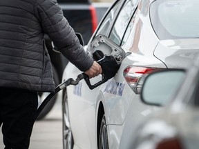 A taxi driver refuels a vehicle at a Gulf gas station in Boston, Massachusetts, U.S., on Tuesday, March 1, 2022. Democratic efforts to define the party's energy policies are facing mounting pressure as surging gasoline prices, Russia's invasion of Ukraine, and the collapse in Congress of President Joe Biden's climate spending package heighten scrutiny of their agenda.