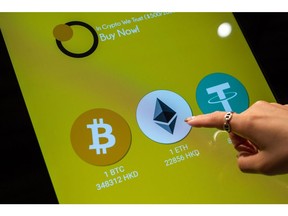 The logos of Bitcoin, left, Ethereum, center, and Tether on a cryptocurrency automated teller machine (ATM) at a CoinUnited cryptocurrency exchange in Hong Kong, China, on Friday, March 4, 2022. Bitcoin fell below $38,000 on March 8, touching its lowest price in a week, as global markets tumbled on concerns that spiraling commodities prices unleashed by Russia's invasion of Ukraine may have a wider and longer-lasting impact than previously thought. Photographer: Paul Yeung/Bloomberg