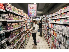 Shoppers browse products inside a supermarket in the Ariana district of Tunis. Photographer: Chedly Ben Ibrahim/Bloomberg