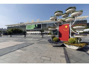 A Chinese flag in front of the Shanghai Railway Station during a lockdown due to Covid-19 in Shanghai, China, on Thursday, May 5, 2022 Source: Bloomberg