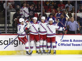 Filip Chytil of the New York Rangers (2nd from right) celebrates his goal against the Carolina Hurricanes. Photographer: Bruce Bennett/Getty Images North America