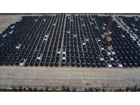 Tesla vehicles waiting for shipping transport in a large lot near the Waigaoqiao Container Port in Shanghai, China. Photographer: Qilai Shen/Bloomberg