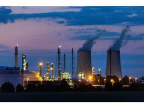 Cooling towers emit vapor at the Leuna refinery and chemical industrial complex, home to refineries and plants operated by TotalEnergies Se, Shell, BASF, Linde AG, and DOMO Group, in Leuna, Germany, on Tuesday, June 7, 2022. TotalEnergies' 240,000 barrels per day Leuna refinery is set to cease importing Russian crude oil via the Druzhba pipeline some time later this year. Photographer: Krisztian Bocsi/Bloomberg